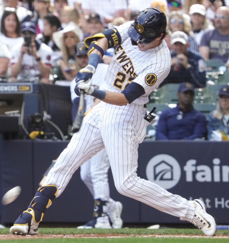 Milwaukee Brewers left fielder Christian Yelich (22) hits the ball during the bottom of the first inning against San Francisco Giants Saturday, May 27, 2023, at American Family Field in Milwaukee.  Ebony Cox / Milwaukee Journal Sentinel