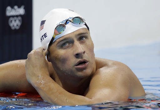 FILE - In this Tuesday, Aug. 9, 2016, file photo, United States' Ryan Lochte checks his time in a men's 4x200-meter freestyle heat during the swimming competitions at the 2016 Summer Olympics, in Rio de Janeiro, Brazil. During an Aug. 30, 2016, appearance on ABC's