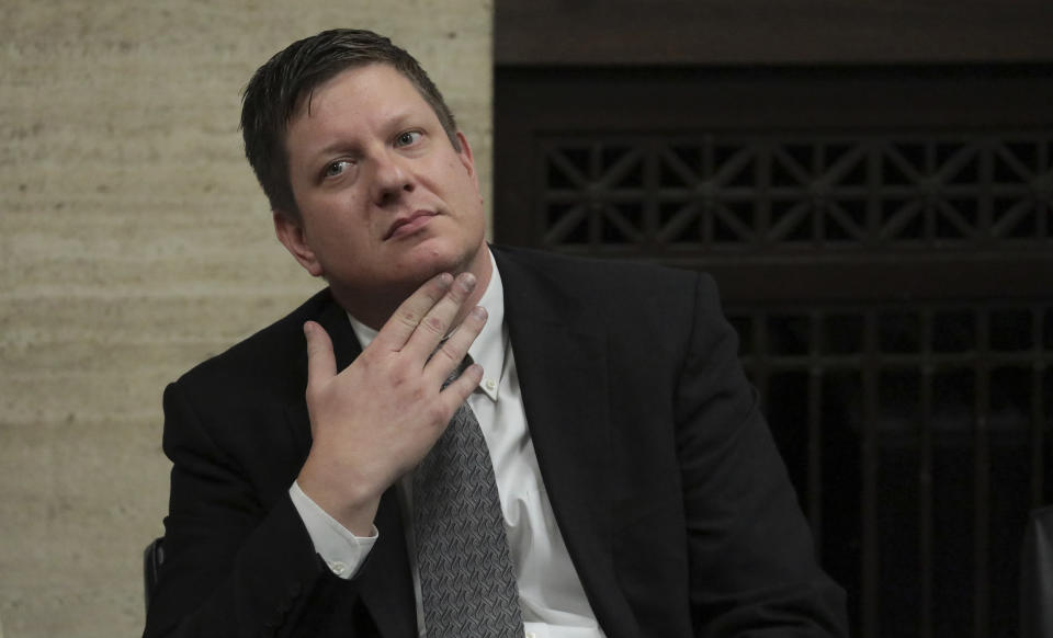 Chicago police Officer Jason Van Dyke listens while attorneys step before Judge Vincent Gaughan bench, as the jury has sent another question to Judge Gaughan, who read it aloud from the bench during deliberations in Van Dyke's trial at the Leighton Criminal Court Building, Friday, Oct. 5, 2018, in Chicago. Van Dyke is charged with first-degree murder, aggravated battery and official misconduct in the shooting of Laquan McDonald. (Antonio Perez/ Chicago Tribune via AP, Pool)