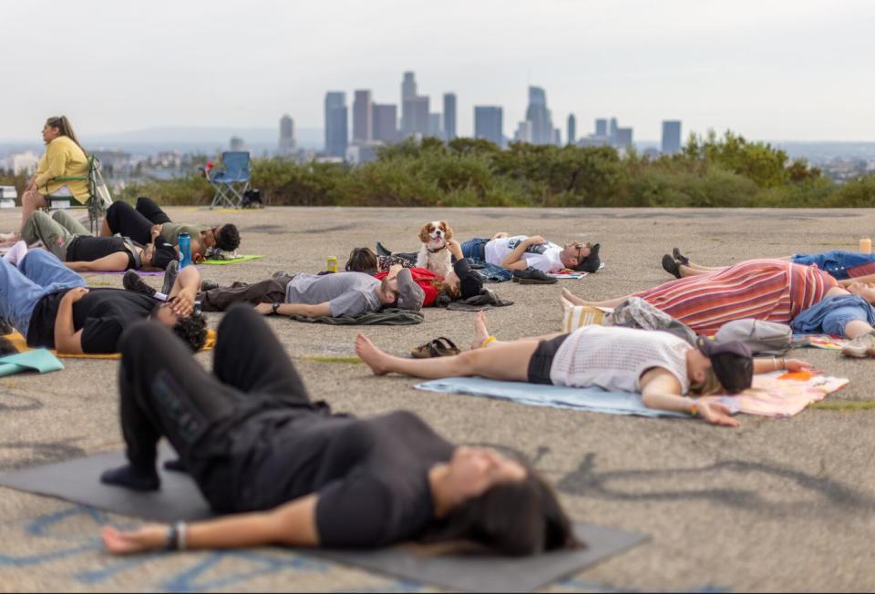 Participants engage in breathing exercises during the Natural High alcohol-free party at Elysian Park.