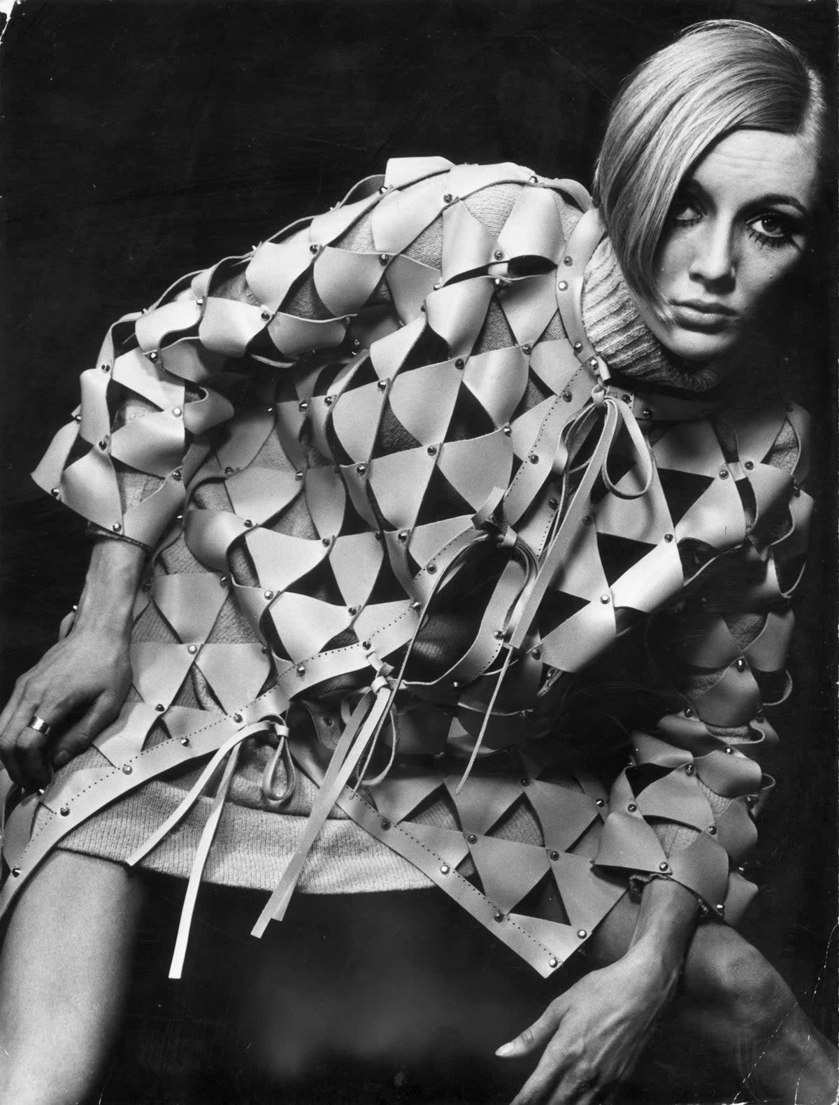 The triangular pieces of leather are nailed together in this coat designed by Paco Rabanne giving an appearance of chain-mail armour (Getty Images)