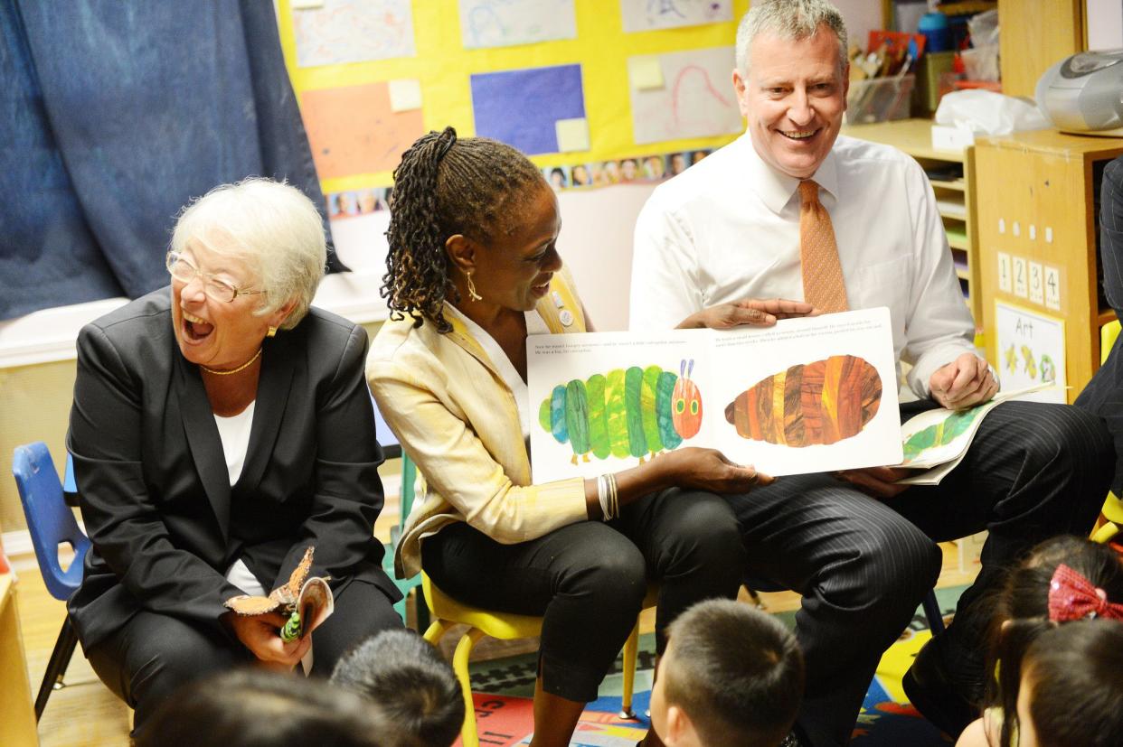 New York Mayor Bill de Blasio (r.), along with Schools Chancellor Carmen Farina (l.) and First Lady Chirlane McCray (c.) reading "The Very Hungry Caterpillar", visits Pre-K classes at Home Sweet Home Children's School in Queens on the first day of NYC public schools on September 4, 2014 in Queens. de Blasio is toured universal pre-kindergarten programs throughout the city after implementing the program ten day prior.