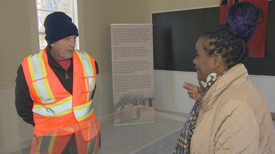 Darrell Acker listens to Angela Davis in the old school. 