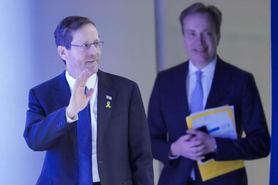 Israel's President Isaac Herzog, left, arrives at the Annual Meeting at the World Economic Forum in Davos, Switzerland, Thursday, Jan. 18, 2024. The annual meeting of the World Economic Forum is taking place in Davos from Jan. 15 until Jan. 19, 2024. (AP Photo/Markus Schreiber)