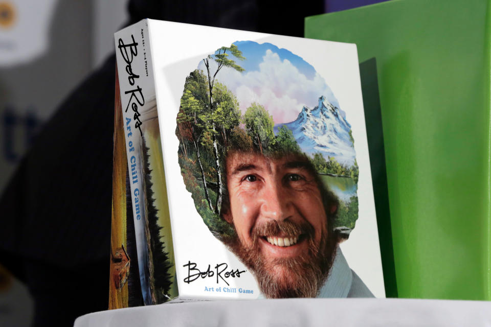 FILE - In this April 26, 2018 file photo, The Bob Ross "Art of the Chill Game," by Big G Creative, is displayed at the TTPM 2018 Spring Showcase, in New York. Ross was known for his unpretentious approach to painting on his long-running show, “The Joy of Painting,” but now the painting he completed on his first show in 1983 is for sale for nearly $10 million. Minneapolis gallery owner Ryan Nelson calls it the ‘rookie card’ for Ross. (AP Photo/Richard Drew)