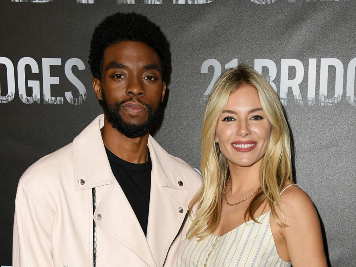 Chadwick Boseman and Sienna Miller at a '21 Bridges' premiere in November 2019 (Jon Kopaloff/Getty Images)