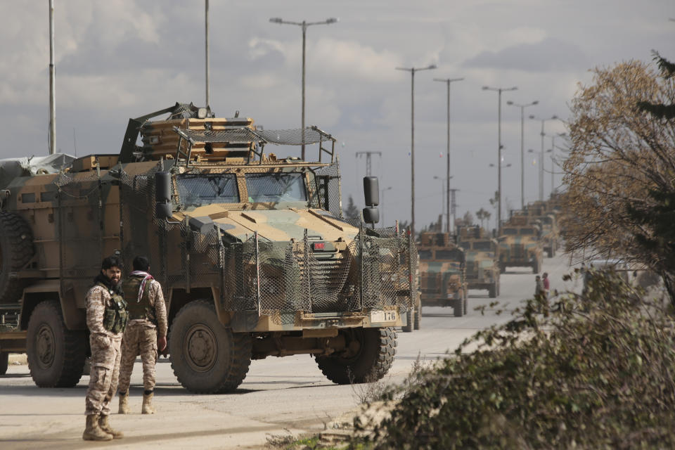 Turkish military convoy drives in Idlib province, Syria, Saturday, Feb. 22, 2020. A Turkish soldier was killed in Syria's northwest Idlib province, state-run Anadolu news agency reported Saturday. (AP Photo/Ghaith Alsayed)