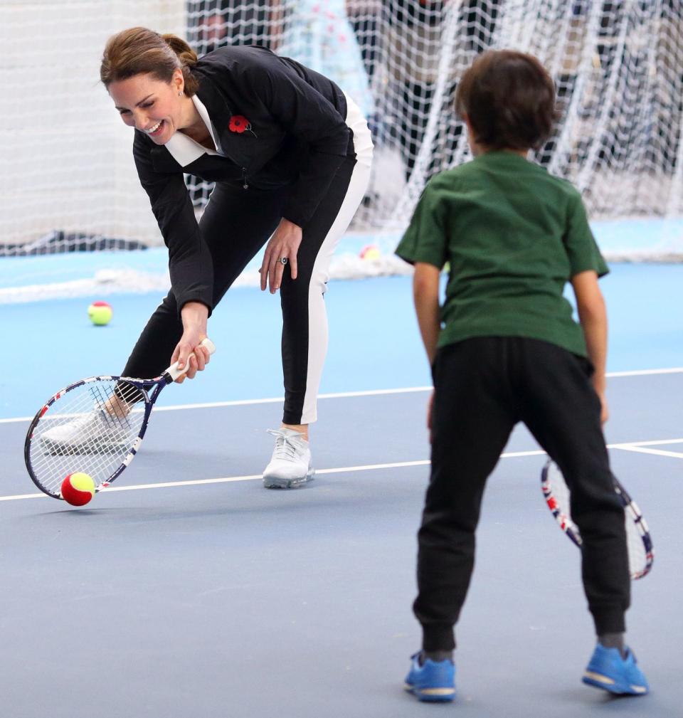 <p>In 2016, Kate took over from the Queen as the royal patron of the Lawn Tennis Association . Here, she embraces her new position by playing around with kids at the National Tennis Centre. </p>