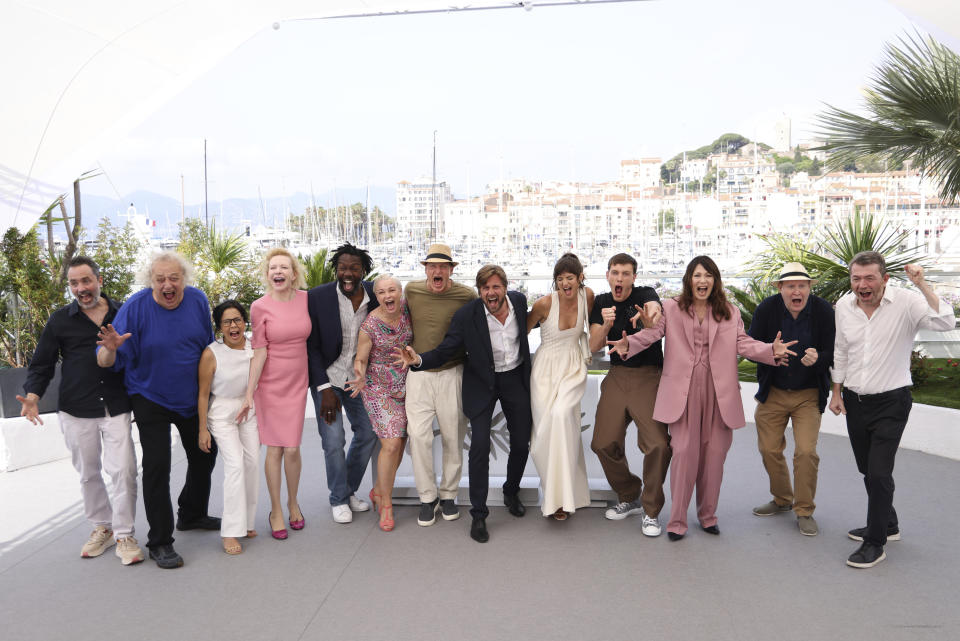 Producer Erik Hemmendorff, from left, Zlatko Buric, Dolly De Leon, Sunnyi Melles, Jean-Christophe Folly, Vicki Berlin, Woody Harrelson, director Ruben Ostlund, Charlbi Dean, Harris Dickinson, Iris Berben, Henrik Dorsin, and producer Philippe Bober pose for photographers at the photo call for the film 'Triangle of Sadness' at the 75th international film festival, Cannes, southern France, Sunday, May 22, 2022. (Photo by Vianney Le Caer/Invision/AP)