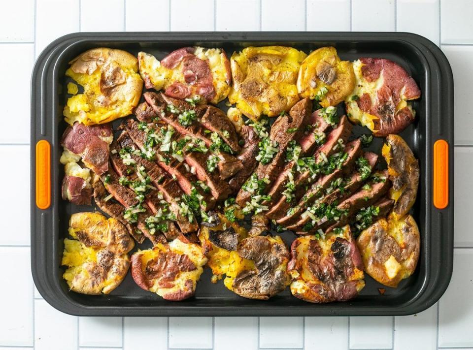 <p>Momofuku</p><p>This sheet-pan dinner from Momofuku founder David Chang is made with steak, potatoes and a handful of fridge and pantry staples.</p><p><strong>Get the recipe: <a href="https://parade.com/1170655/kelli_acciardo/momofuku-soy-marinated-flank-steak-with-savory-smashed-potatoes/" rel="nofollow noopener" target="_blank" data-ylk="slk:Momofuku's Soy-Marinated Flank Steak with Savory Smashed Potatoes;elm:context_link;itc:0;sec:content-canvas" class="link ">Momofuku's Soy-Marinated Flank Steak with Savory Smashed Potatoes</a></strong></p>