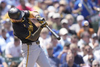 Pittsburgh Pirates' Jared Triolo hits a two-run home run off Chicago Cubs starting pitcher Kyle Hendricks during the third inning of a baseball game Friday, May 17, 2024, in Chicago. (AP Photo/Charles Rex Arbogast)