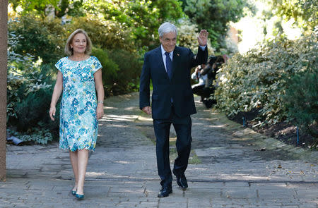 Chilean president elect Sebastian Pinera waves to media next to his wife Cecilia Morel in front of his house in Santiago, Chile, December 18, 2017. REUTERS/Rodrigo Garrido