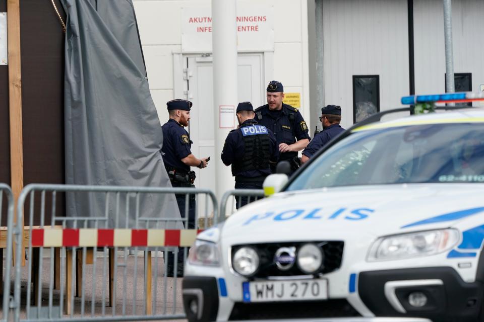 Police monitor the area at the scene of a shooting in Kristianstad (EPA)