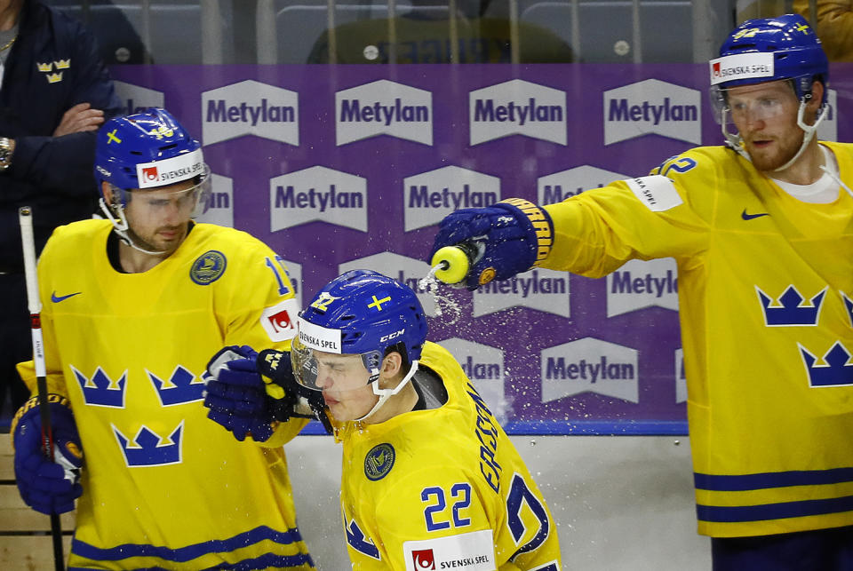 <p>Gabriel Landeskog of Sweden pours water over his team mate Joel Eriksson Ek who scored a goal, at the 2017 IIHF World Championship on May 12, 2017. (Photo: Wolfgang Rattay/Reuters) </p>