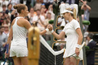 Britain's Katie Boulter greets Karolina Pliskova of the Czech Republic at the net after winning a second round women's singles match on day four of the Wimbledon tennis championships in London, Thursday, June 30, 2022. (AP Photo/Kirsty Wigglesworth)