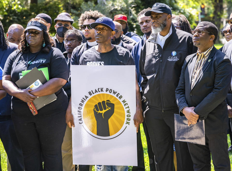 FILE - Supporters listen as speakers share their views on reparations and other issues during the Black Power Network news conference at the state Capitol, Wednesday, May 10, 2023. California's Legislative Black Caucus released a slate of reparations bills this week that strive to implement ideas from a landmark task force that studied the issue for two years. The proposals include a formal apology from the state, for its role in facilitating slavery and compensation for property seized from Black owners.(Cameron Clark/The Sacramento Bee via AP, File)