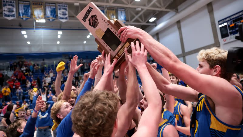Parowan celebrates their win over Kanab in the 2A high school boys basketball championship game at Salt Lake Community College in Taylorsville on Saturday, Feb. 25, 2023.