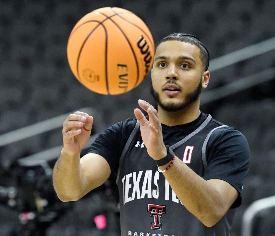 Texas Tech's forward Kevin Obanor (0) receives a pass during practice ahead of the Big 12 basketball tournament, Tuesday, March 7, 2023, at T-Mobile Center in Kansas City. 