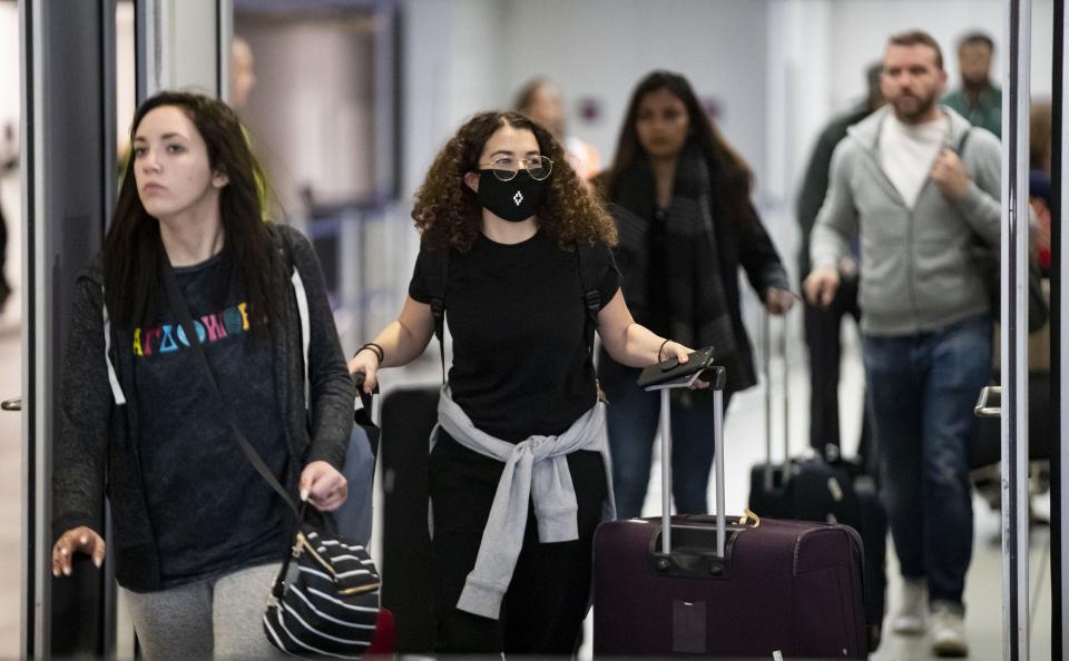 Passengers are arriving on international flights at Terminal 5 of O'Hare International Airport.