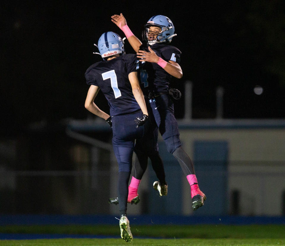 Springfield's Jackson Babbitt, left, and Jaevon Spencer celebrate a touchdown against Willamette during the first half of the game in Springfield on Friday, Oct. 13, 2023.