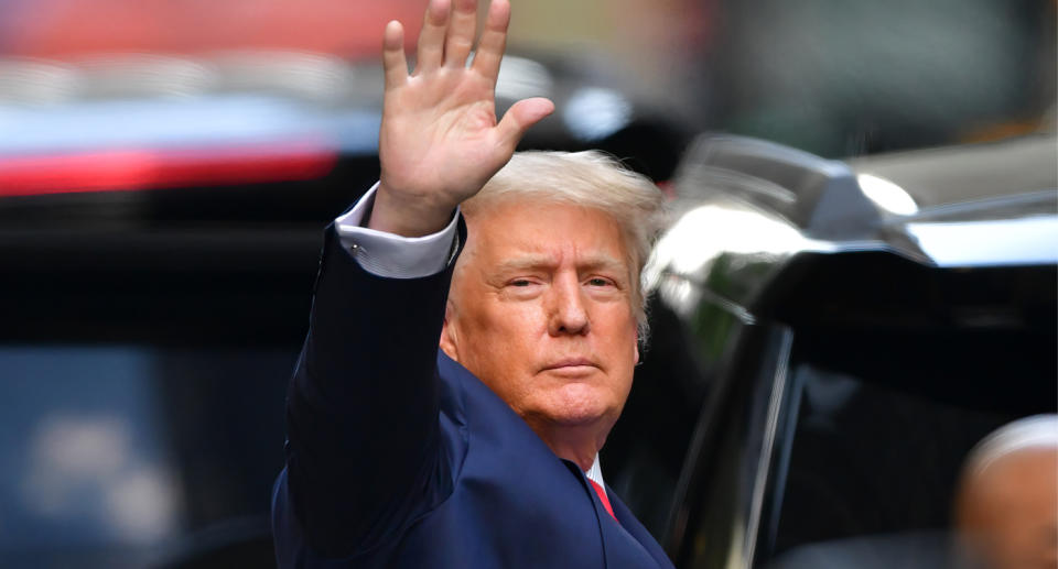 Donald Trump waves to cameras. 