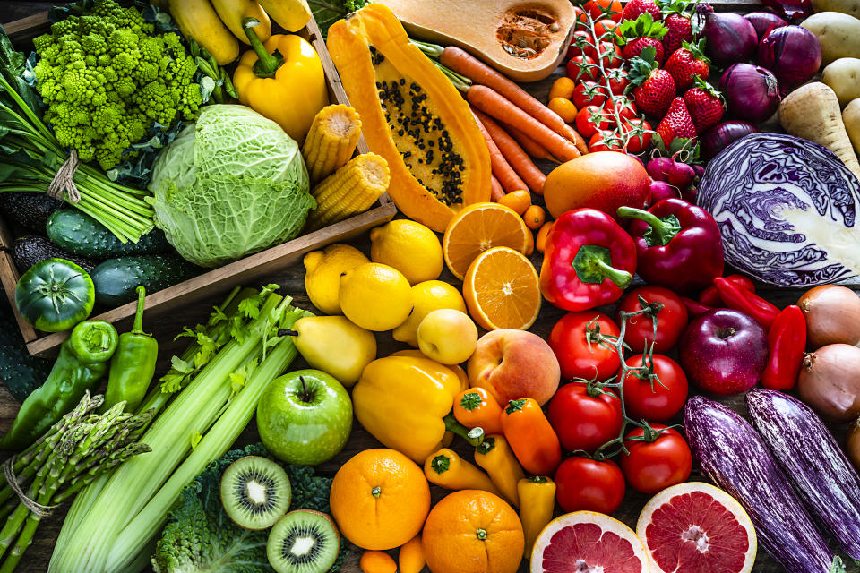 High angle view of a large assortment of healthy fresh rainbow colored organic fruits and vegetables