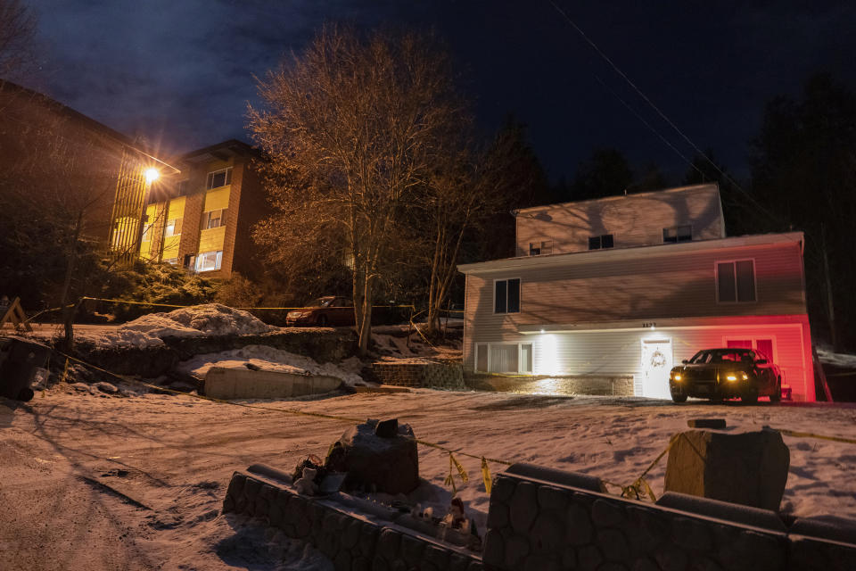 A private security officer sits in a vehicle, Tuesday, Jan. 3, 2023, in front of the house in Moscow, Idaho where four University of Idaho students were killed in November, 2022. Authorities said Wednesday, Jan. 4, that Bryan Kohberger, the man accused in the killings, has left a Pennsylvania jail in the custody of state police. The move means Kohberger could be headed to Idaho to face first-degree murder charges. (AP Photo/Ted S. Warren)