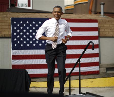 U.S. President Barack Obama arrives to deliver remarks on the government funding impasse at M. Luis Construction, a local small business in Rockville, Maryland, near Washington, October 3, 2013. REUTERS/Jason Reed