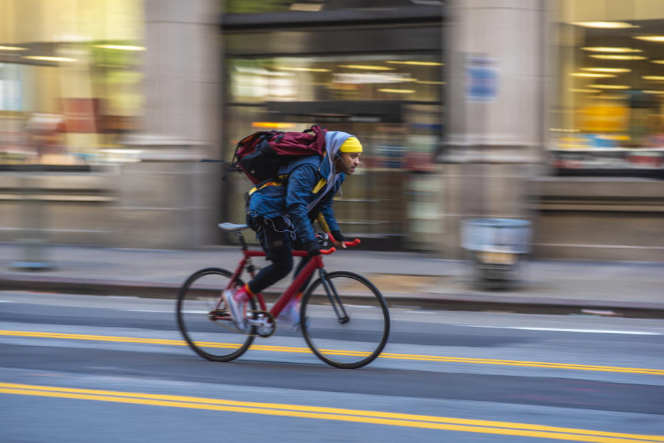 someone riding a bike on a city street