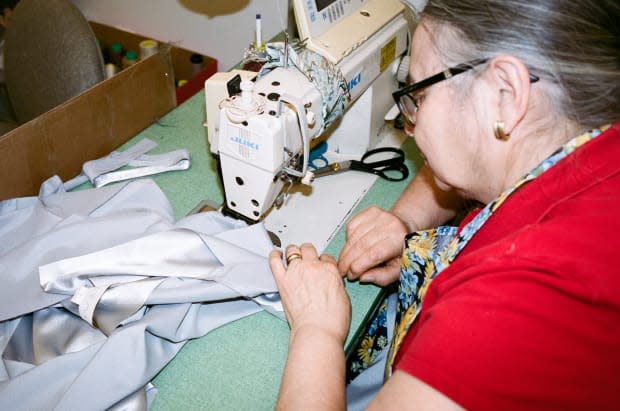 A seamstress at Ellie Mae Studios. Photo: Courtesy Ellie Mae Studios