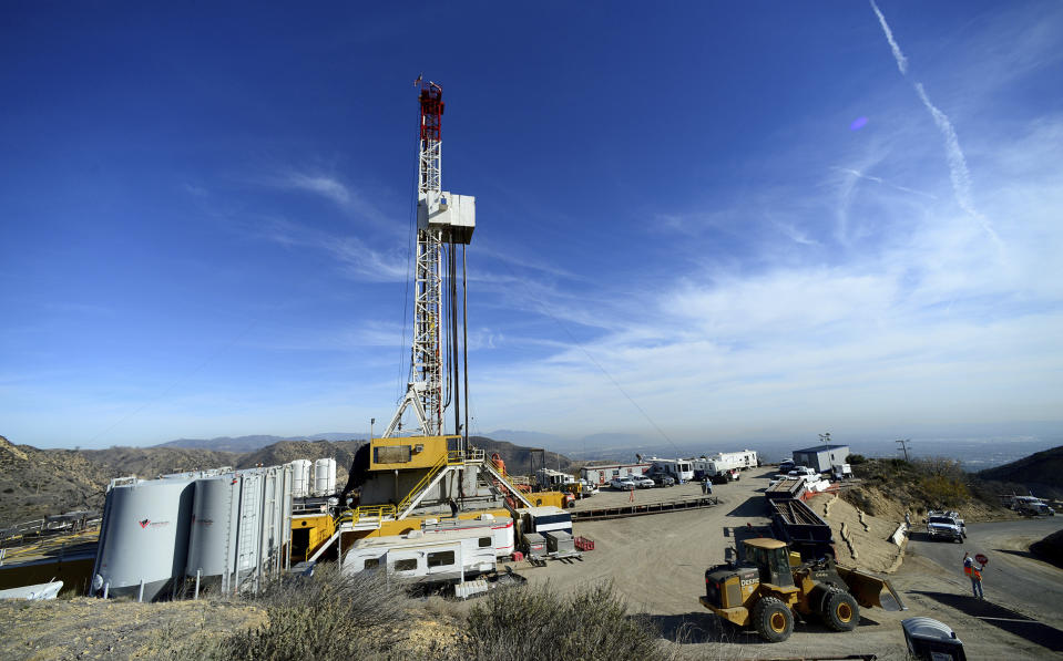 FILE - Crews from SoCalGas and outside experts work on a relief well to be connected to a leaking well at the Aliso Canyon facility above the Porter Ranch area of Los Angeles, on Dec. 9. 2015. California officials are expected to vote Thursday, Aug. 31, 2023, on a proposal to increase storage capacity at the site of the nation's largest-known methane leak. (Dean Musgrove/Los Angeles Daily News via AP, Pool, File)