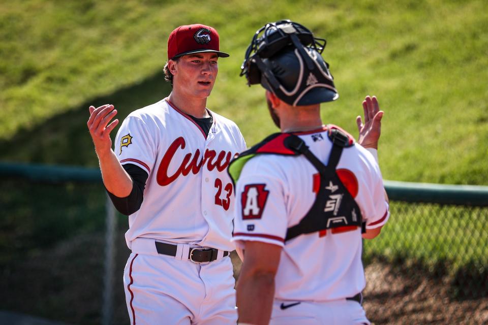 Altoona Curve pitcher Kyle Nicolas (23), a former Jackson High School star, is greeted by catcher Carter Bins during an April 23, 2022 game against New Hampshire in Altoona.
