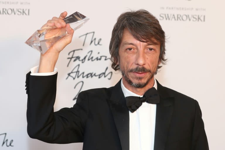 Valentino's Italian fashion designer Pierpaolo Piccioli poses with his designer of the year award