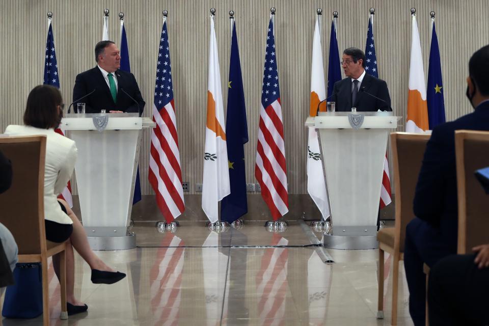 U.S. Secretary of State Mike Pompeo, left, Cypriot President Nicos Anastasiades make statements during a press conference at the Presidential Palace in Nicosia, Cyprus, Saturday, Sept. 12, 2020. Pompeo's lightning visit to Cyprus aimed to de-escalate a confrontation between Greece and Turkey over energy reserves in east Mediterranean waters and to affirm Washington's continued engagement in the tumultuous region four days after Russian Foreign Minister Sergey Lavrov pitched Moscow's offer to help ease tensions during his trip to the island nation. (AP Photo/Petros Karadjias, Pool)