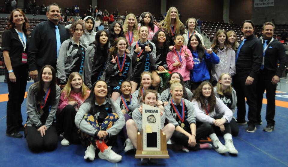 The Canyon View girls wrestling team celebrates earning the school’s first team wrestling title during the 3A state tournament Saturday, Feb. 17, 2024, in Richfield.&nbsp;