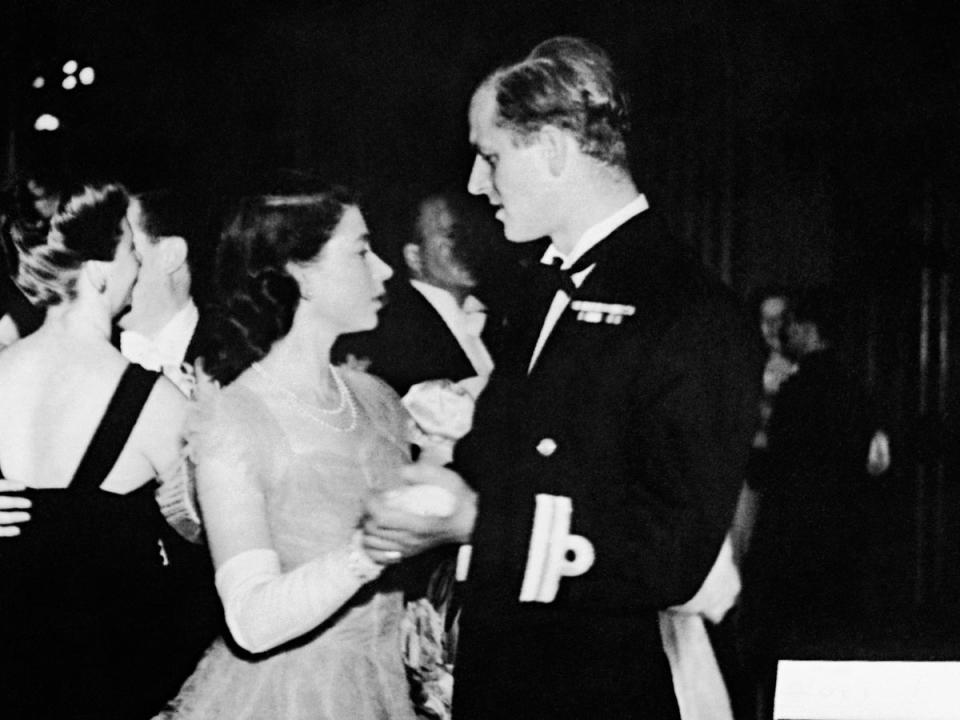 Dancing with her then-fiance, Philip Mountbatten, at the Assembly Rooms, Edinburgh (PA)