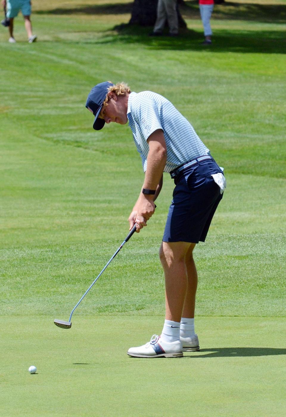 Gavin Newkirk of Batavia, Ill. sends in a put on his final hole of the opening round Tuesday.