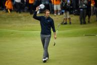 USA's Jordan Spieth acknowledges the crowd after holing a putt on the 18th green to win The Open Championsip REUTERS/Hannah McKay