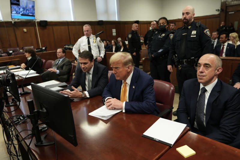 Former President Donald Trump sits in the courtroom at Manhattan Criminal Court in New York on Tuesday. "I've been here for almost four weeks in an icebox, they call it the icebox, listening to a judge who is totally corrupt and conflicted,” the former president told reporters before entering court. Pool photo by Curtis Means/UPI