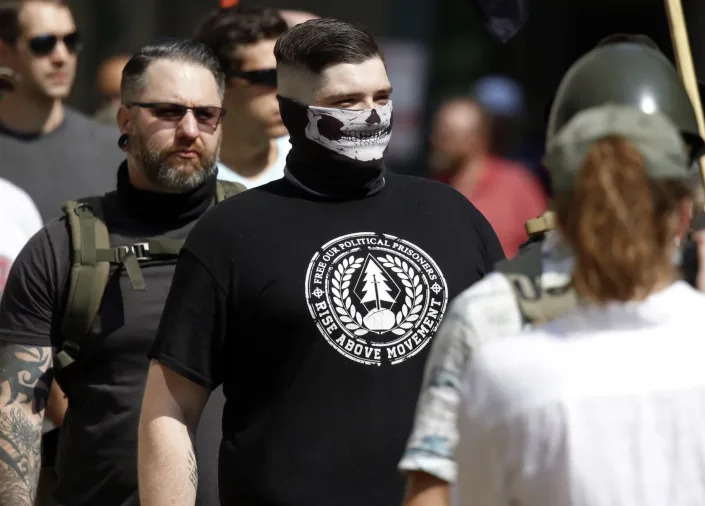 A white nationalist wearing a Rise Above Movement T-shirt 