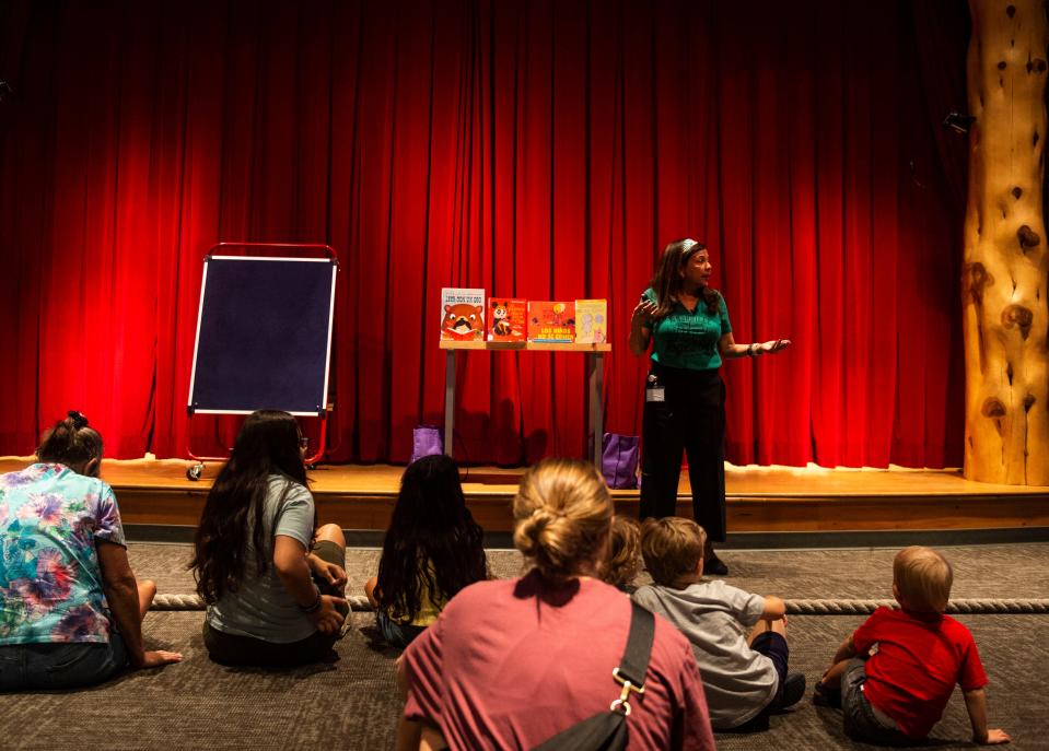 Pat Bashir leads CuentaCuentos, a bilingual story hour, at the downtown Nashville Public Library on July 26. Bashir works as the children's services manager for the library system.