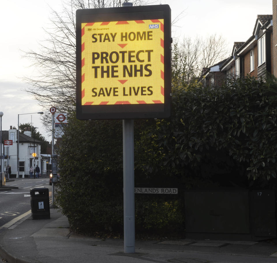 Photo by: zz/KGC-254/STAR MAX/IPx 2021 2/20/21 An NHS illuminated digital billboard with changing messages reminding the public to stay home, wear face masks, practice proper social distancing measures and not to take risks or bend the rules is seen on February 20, 2021 in the town of Staines-upon-Thames during the worldwide coronavirus pandemic. Emergency lockdown restrictions are continued in The United Kingdom as health officials take measures to prevent new variants of the virus from affecting greater Europe. (Staines-upon-Thames, Greater London, England, UK)