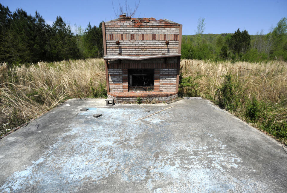 The remains of a home destroyed during a tornado outbreak a decade ago are shown on April 13, 2021, in Shoal Creek Valley near Ashville, Ala. Time hasen't fill the voids created by a massive tornado outbreak that killed more than 320 people in six states a decade ago. (AP Photo/Jay Reeves)