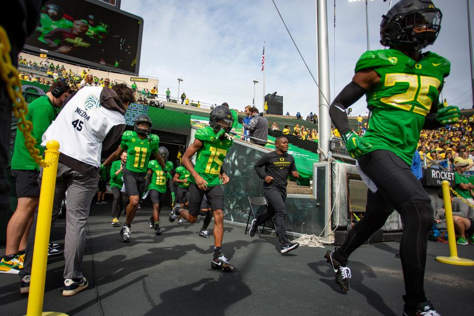Oregon players take the field during warm ups as the Oregon Ducks host Colorado in the Pac-12 opener Saturday, Sept. 23, 2023, at Autzen Stadium in Eugene, Ore.