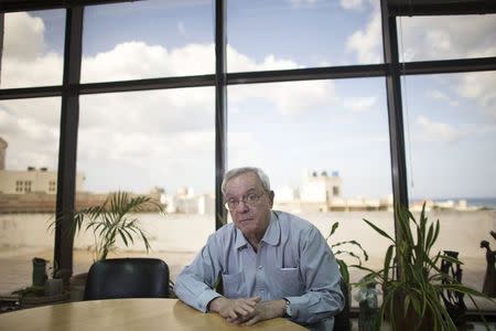 Eusebio Leal, a leading intellectual and the official historian of the city of Havana, poses for a photograph during an interview with Reuters at his office in Havana January 9, 2015. REUTERS/Alexandre Meneghini