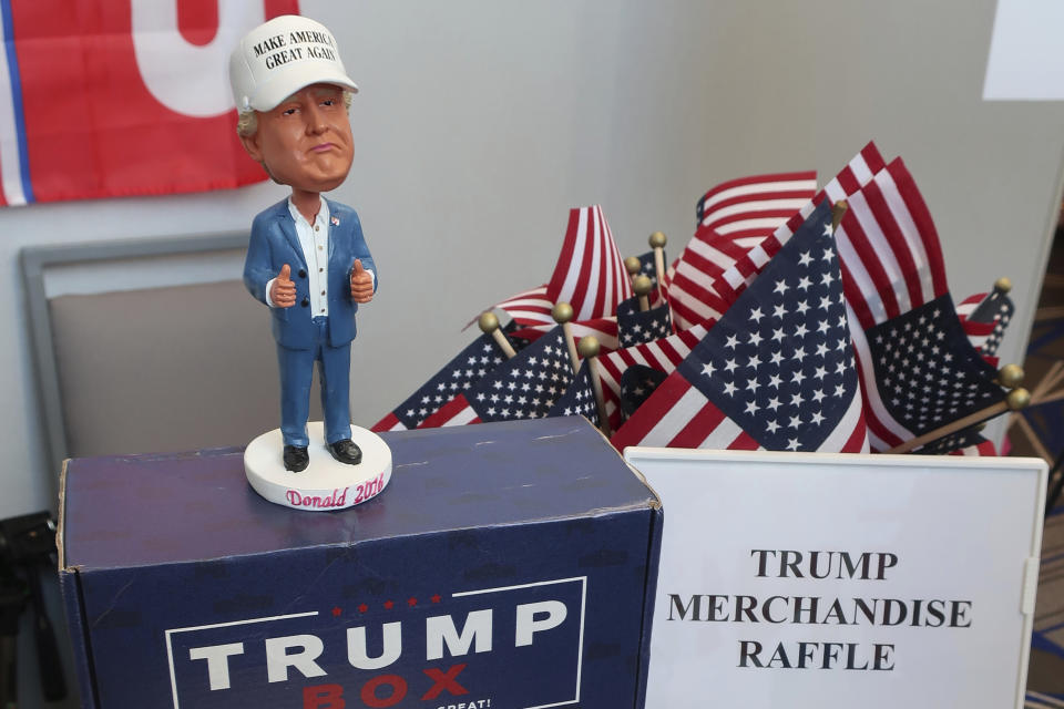 In this Saturday, Feb. 1, 2020, photo, a figurine of President Donald Trump is on display at a table for the campaign for Adrienne Vallejo Foster, a Republican candidate for Congress in Kansas, in Olathe, Kan. Her campaign was raffling off the item during a Kansas Republican Party convention. (AP Photo/John Hanna)