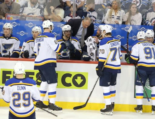 St. Louis head coach Craig Berube, centre, has taken the Blues from the worst team in the league to the Stanley Cup finals in just four months