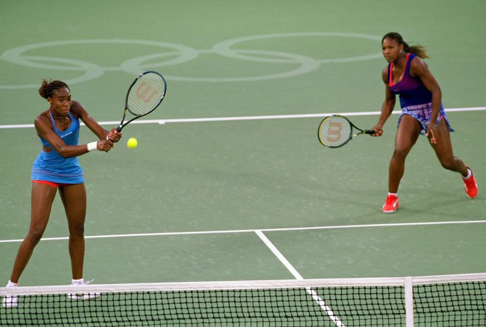 <p>Venus and Serena Williams in action in the Womens Doubles Tennis Final at the NSW Tennis Centre on Day 13 of the Sydney 2000 Olympic Games in Sydney, Australia. Mandatory Credit: Clive Brunskill /Allsport </p>