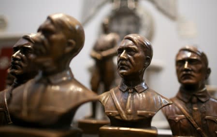 Busts of Hitler are displayed during a news conference at the Holocaust museum in Buenos Aires