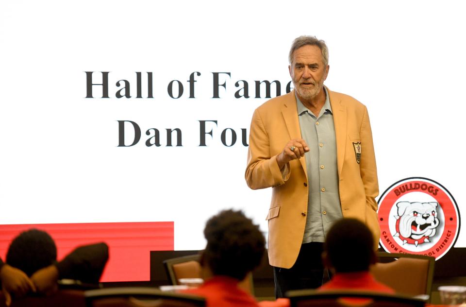 Hall of Fame quarterback Dan Fouts speaks to The Future 40, a group of fourth grade Canton City Schools boys, during their visit to the Pro Football Hall of Fame.